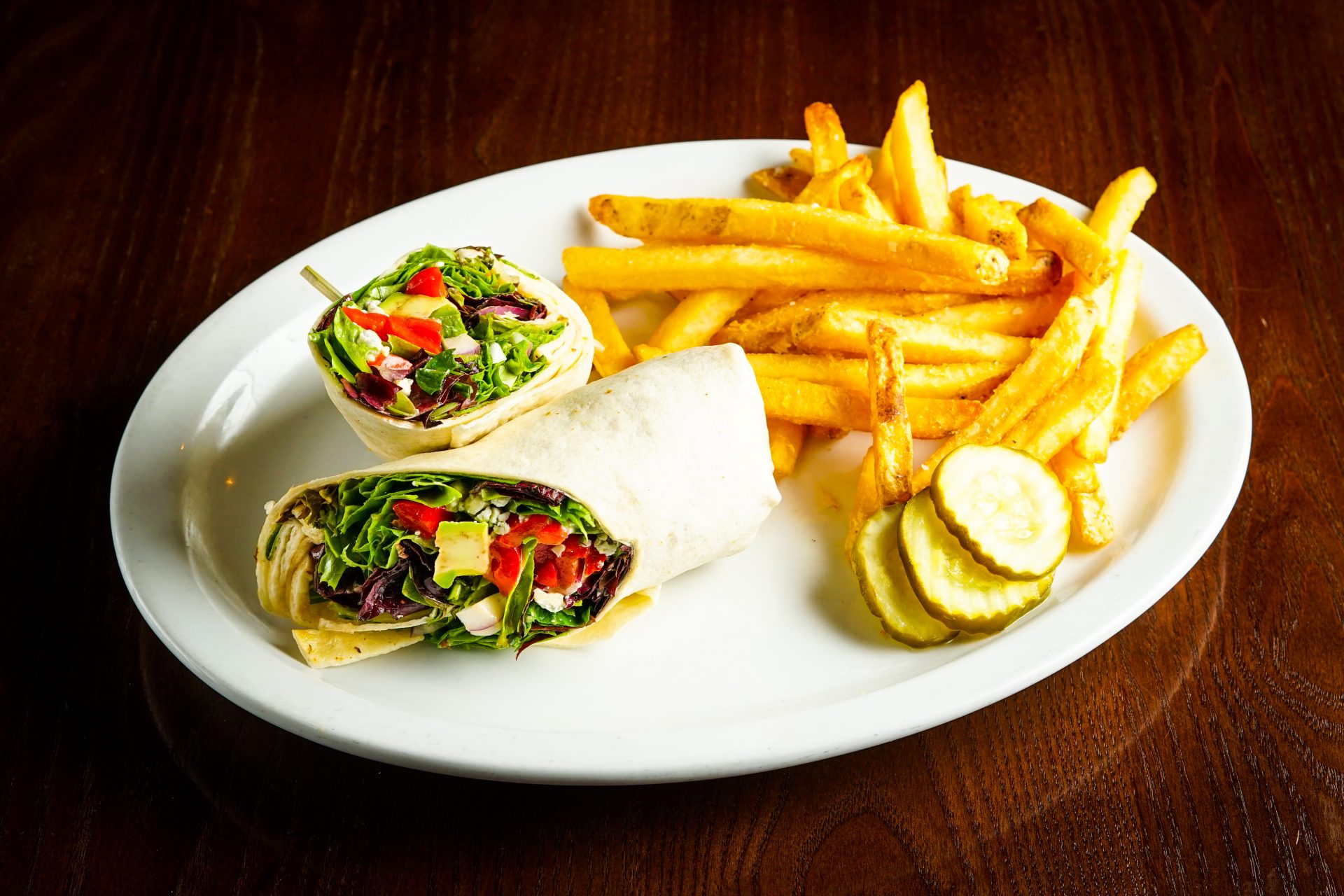 Image of California Wrap - Avocado, Red Onion, Roasted Red Pepper, Bleu Cheese, Mixed Greens dressed with Champagne Vinaigrette, Flour Tortilla