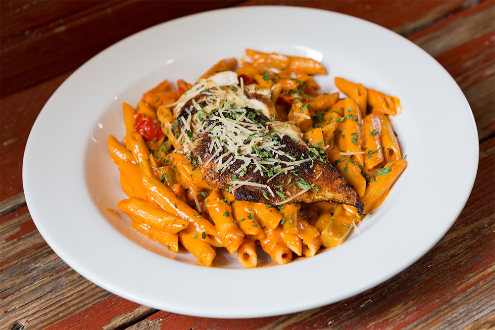 Image of New Orleans Pasta - Blackened Chicken, Penne Pasta, Holy Trinity Vegetables, Spicy Creole Cream Sauce